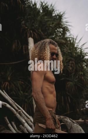 Stylish man with long curly blond hair Stock Photo