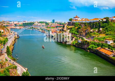 Douro river and local houses with orange roofs in Porto city aerial panoramic view. Porto is the second largest city in Portugal. Stock Photo