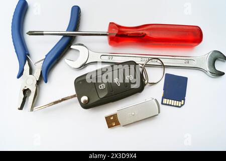 car key, tools and memory card, symbolic image for the emissions scandal, Dieselgate Stock Photo