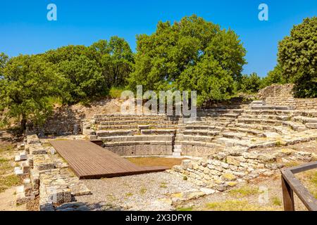 Ruins of odeon in Troy ancient city in Canakkale Turkiye. Roman era of Troy city. Stock Photo