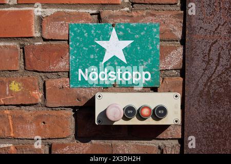 Nödstopp (Swedish: 'emergency stop') sign and small panel of buttons Stock Photo