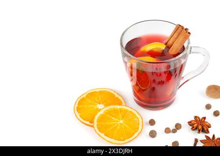 Mulled wine with orange, cinnamon sticks, anise isolated on white background. Flat lay. Free space for text. Stock Photo