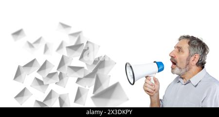 An elderly man says something into a megaphone isolated on white, spam mailing Stock Photo