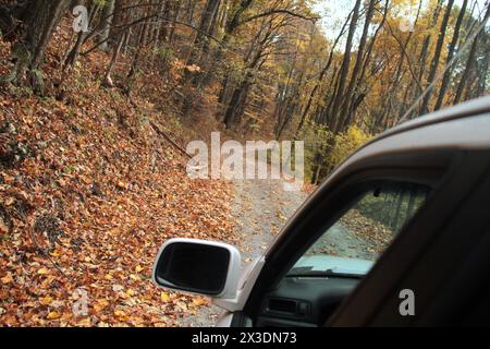 Virginia, U.S.A. Driving on an unpaved mountain road in late October. Stock Photo