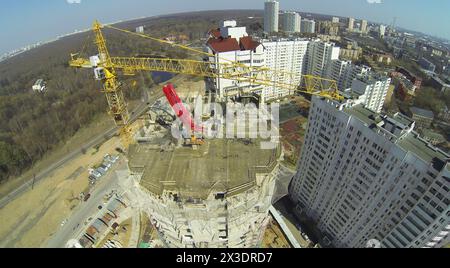 Construction of a new building in a residential area, aerial view Stock Photo