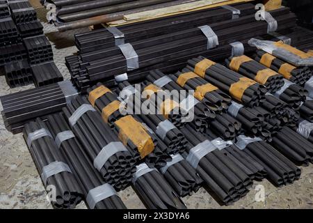 MOSCOW, RUSSIA - OCT 27, 2017: (PR) Packed sections of steel pipes of different cross-section in warehouse of DB 527 company producer of russian sport Stock Photo