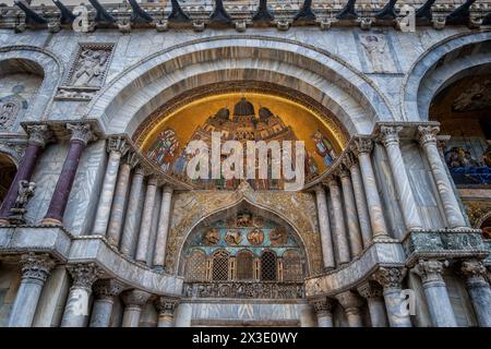St. Mark Basilica (Basilica di San Marco) in Venice, Italy. Western facade details with Byzantine style mosaic (13th century) representing body of Sai Stock Photo