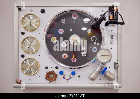Old monitor with clock, thermometer, barometer, hygrometer devices and etc. mounted on screen. Stock Photo
