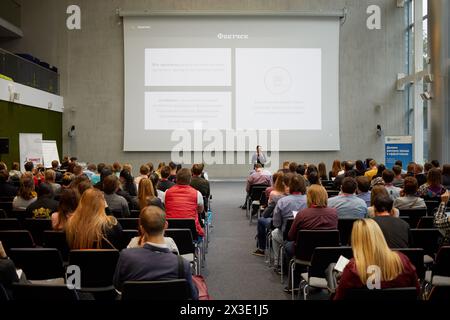 MOSCOW, RUSSIA - SEP 30, 2017: Participants of conference Day of Internet Advertising listen to speaker in auditorium of Headquarters Mail.Ru Group. Stock Photo