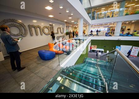 MOSCOW, RUSSIA - SEP 30, 2017: Participants of conference Day of Internet Advertising listen to speaker on balcony in auditorium of Headquarters Mail. Stock Photo