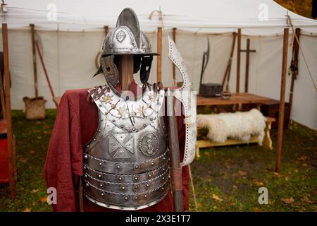 Metal hussar armour of seventeenth century and poleaxe. Stock Photo