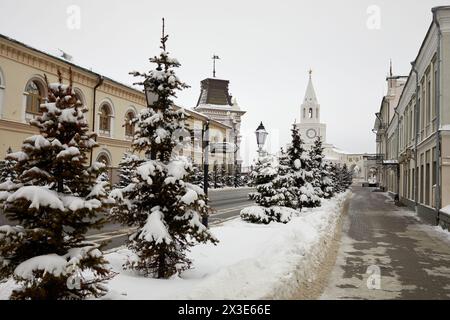 KAZAN, RUSSIA - DEC 10, 2017: End of Kremlyovskaya street, National Museum of Republic Tatarstan and Spasskaya Tower on winter day. Spasskaya Tower is Stock Photo