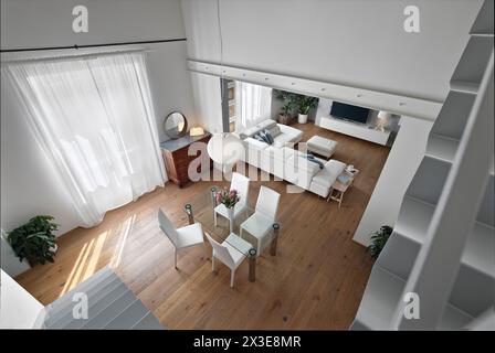 shot of the interior of a modern dining room in the foreground there is a dining table with its chairs seen from above Stock Photo