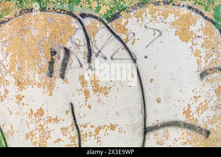 Abstract detailed wall texture with green white graffiti paint. Stock Photo