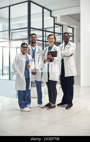 Diversity, doctors and healthcare portrait in hospital for collaboration with wellness advice, clipboard and team. Happy, global students and Stock Photo