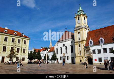 Historic buildings in Bratislava's main square include the Old Town Hall and the Jesuit Church. Stock Photo