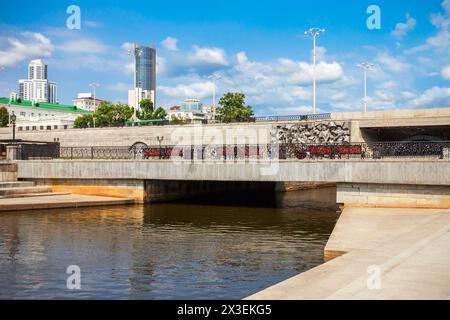 Plotinka weir on river Iset in Yekaterinburg, Russia. The Iset River in Western Siberia flows from the Urals through the Sverdlovsk, Kurgan and Tyumen Stock Photo