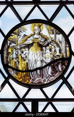 Stained glass roundel in leaded window at Speke Hall, Grade I listed National Trust Tudor manor house,  Liverpool, England, UK. Stock Photo