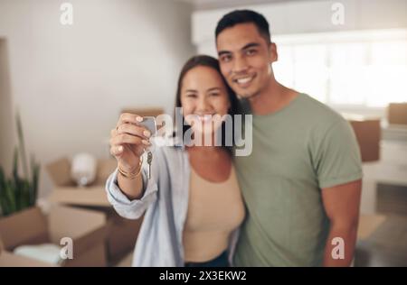 Portrait confident couple with house keys outside new house Stock Photo ...