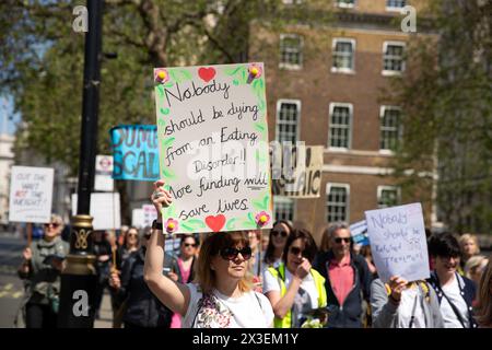 Participants march for those affected by eating disorders in central London. Stock Photo