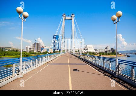 Vynogradovskiy Bridge is a cable-stayed bridge over the canal of the Yenisei, leads to Tatyshev island in Krasnoyarsk, Russia Stock Photo