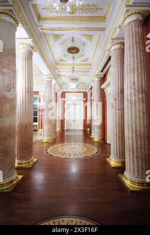 MOSCOW - SEP 16, 2017: Beautiful tall marble columns in luxury hallway with parquet floor in Tsaritsyno palace Stock Photo