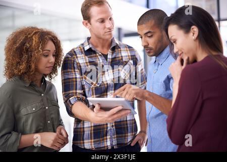 Web designers, meeting and tablet with collaboration, planning and digital project in an office. Technology, people and website developers with Stock Photo