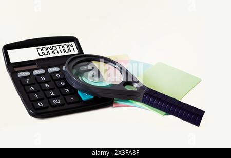 Donation word on calculator display and white background with stickers Stock Photo