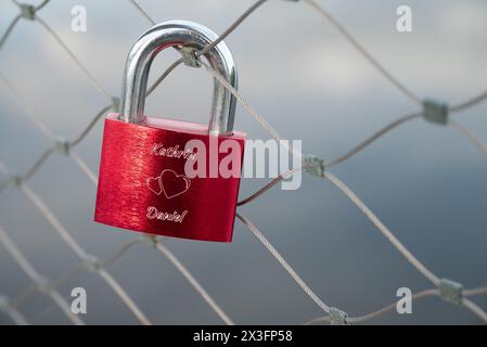 Love Lock on a fence, railing above the Danube with names Daniel and Kathrin in Deggendorf, Bavaria, Germany Stock Photo