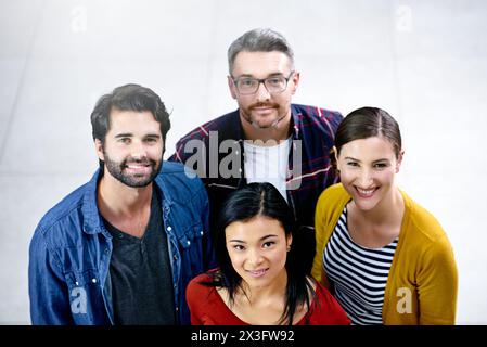 High angle, portrait and office for smile, creatives or team for collaboration and small business. Web designers, startup and employee workshop for Stock Photo