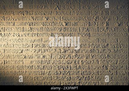 Stucco wall with brick ornament with illumination Stock Photo