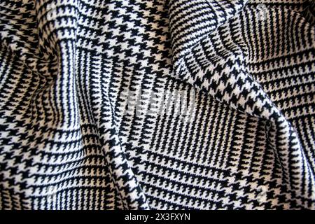 White black cage cotton gentle texture clothes. Cage textile cloth background in sun summer day for fashion clothing. Stock Photo
