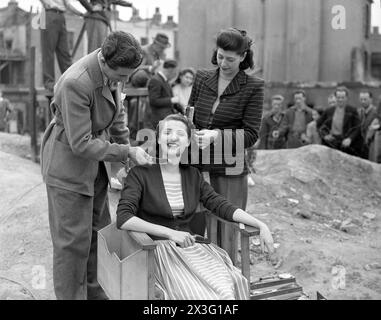 British Actress BARBARA MURRAY having her hair and make-up done before filming a scene for the EALING  comedy PASSPORT TO PIMLICO 1949 filmed on location in a large bombsite in Lambeth Director HENRY CORNELIUS Screenplay T.E.B. CLARKE Music GEORGES AURIC Ealing Studios Stock Photo