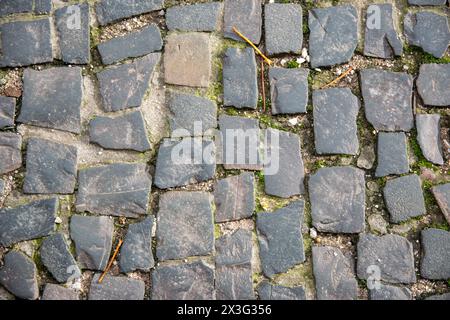 Grey brick wall background. Gray stone block surface with horizontal texture of gray brick. Stock Photo