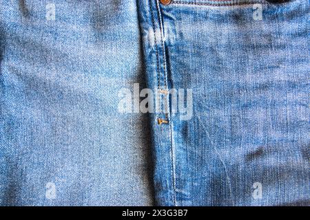 Blue jeans cotton gentle texture clothes. Textile cloth background. Denim with day light. Stock Photo