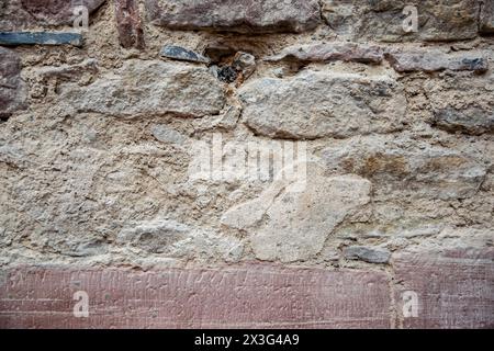 Structural stone wall of the ancient building. Gray stone tile block background with horizontal texture of gray brick. Stock Photo