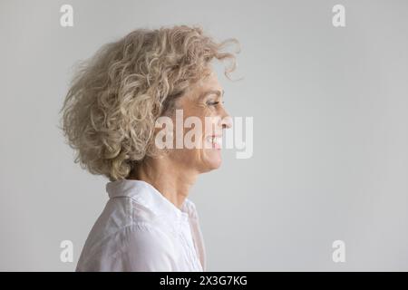 Side profile view of happy middle-aged woman Stock Photo