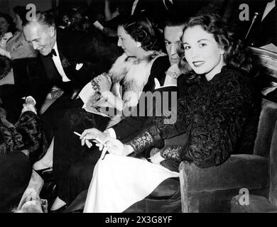 HAZEL COURT (on right) at the premiere at The New Gallery cinema, Regent Street, London in June 1947 of GOOGIE WITHERS JEAN KENT and JOHN McCALLUM in THE LOVES OF JOANNA GODDEN 1947 directors CHARLES FREND and (uncredited) ROBERT HAMER novel Sheila Kaye-Smith screenplay H.E. Bates music Ralph Vaughan Williams producer Michael Balcon Ealing Studios / General Film Distributors (GFD) Stock Photo