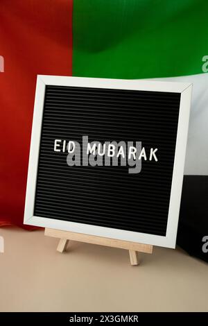 RAMADAN text frame on United Arab Emirates waving flag made from silk ...