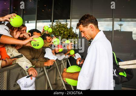 Madrid, Spain. 26th Apr, 2024. Casper Ruud of Norway signs autographs for fans on Day Five of the Mutua Madrid Open 2024 tournament at La Caja Magica. Credit: SOPA Images Limited/Alamy Live News Stock Photo