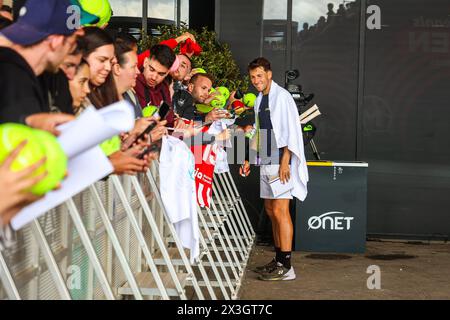 Madrid, Spain. 26th Apr, 2024. Casper Ruud of Norway signs autographs for fans on Day Five of the Mutua Madrid Open 2024 tournament at La Caja Magica. (Photo by Miguel Reis/SOPA Images/Sipa USA) Credit: Sipa USA/Alamy Live News Stock Photo