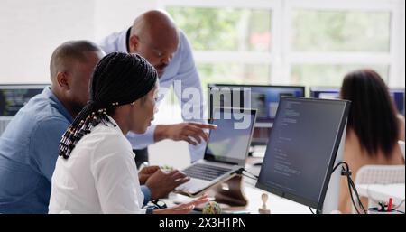 African developer team working on computer code for business Stock Photo