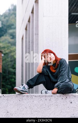 Fashionable young Korean woman posing casually outdoors Stock Photo
