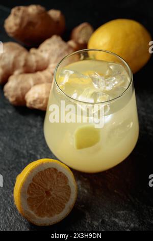 Ginger Ale with ice and lemon. Homemade lemon and ginger organic probiotic drink. Stock Photo