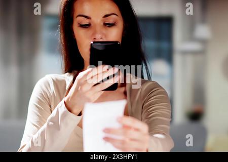 Taking a picture of a receipt document using OCR Stock Photo