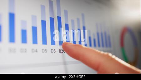 Close-up Of Businessman Analyzing Graph On Touchscreen Monitor Stock Photo