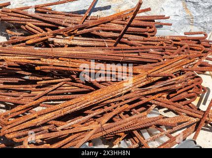 Background of rusted iron bars. Randomly stacked irons. Stock Photo