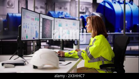 Engineer Operators Using Scada System At Industrial Plant Stock Photo