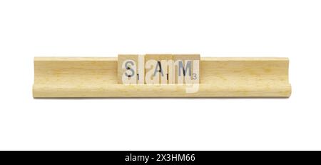 Miami, FL 4-18-24 popular baby boy first name of SAM made with square wooden tile English alphabet letters with natural color and grain on a wood rack Stock Photo