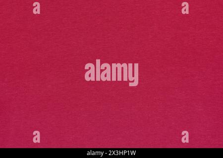 Closeup of magenta cotton jersey plain fabric with stitches texture Stock Photo